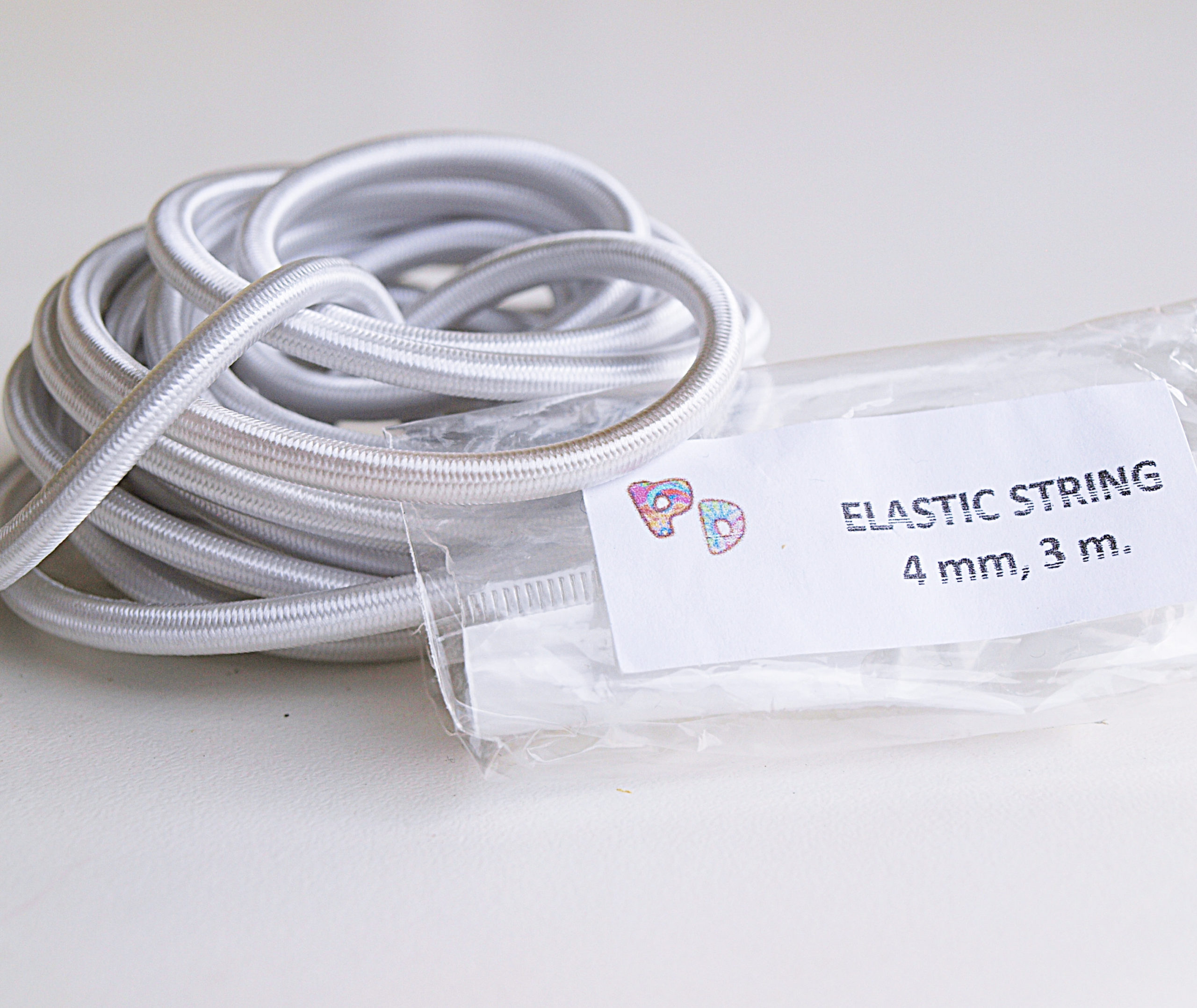 Elastic cord for stringing dolls. - PRODOLLS